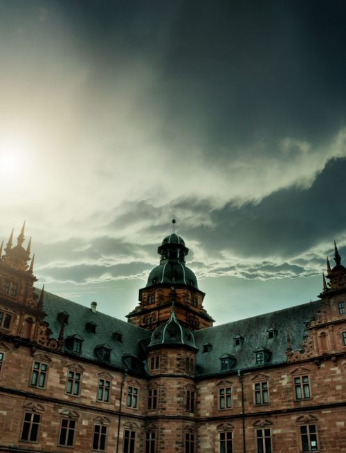Low-angle shot of Johannisburg Castle with a dramatic sky in the background, Aschaffenburg, Germany