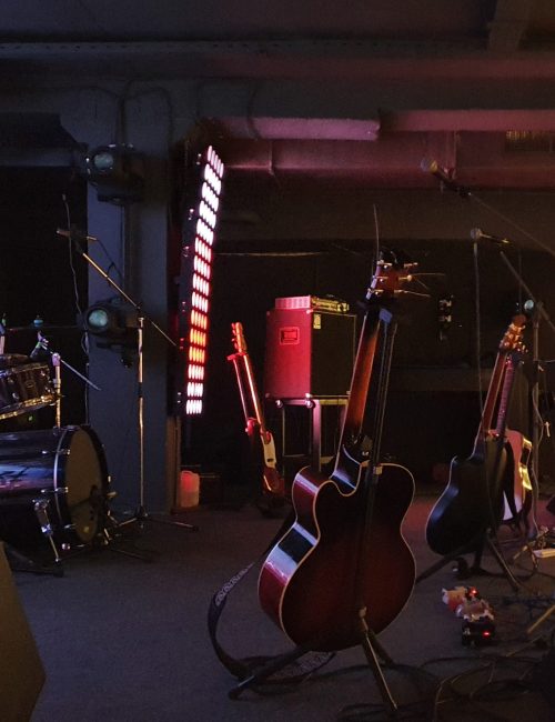 A stage with musical instruments and lighting